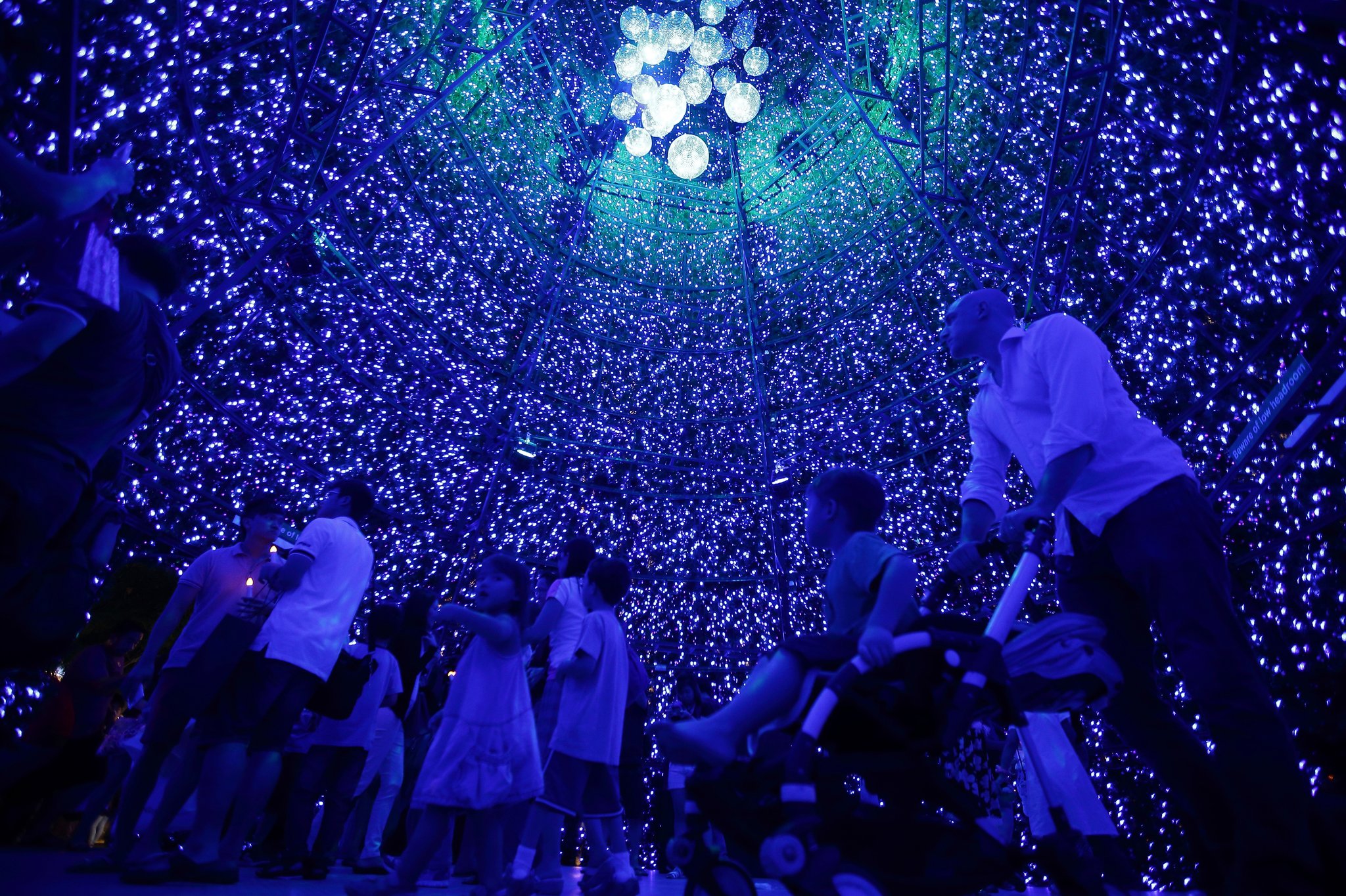 people-explored-inside-giant-christmas-tree-along-orchard-min
