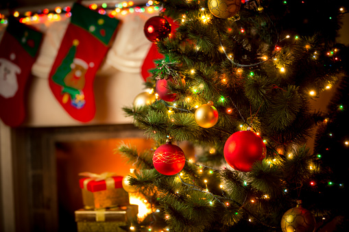 decorated fireplace and Christmas tree at cottage